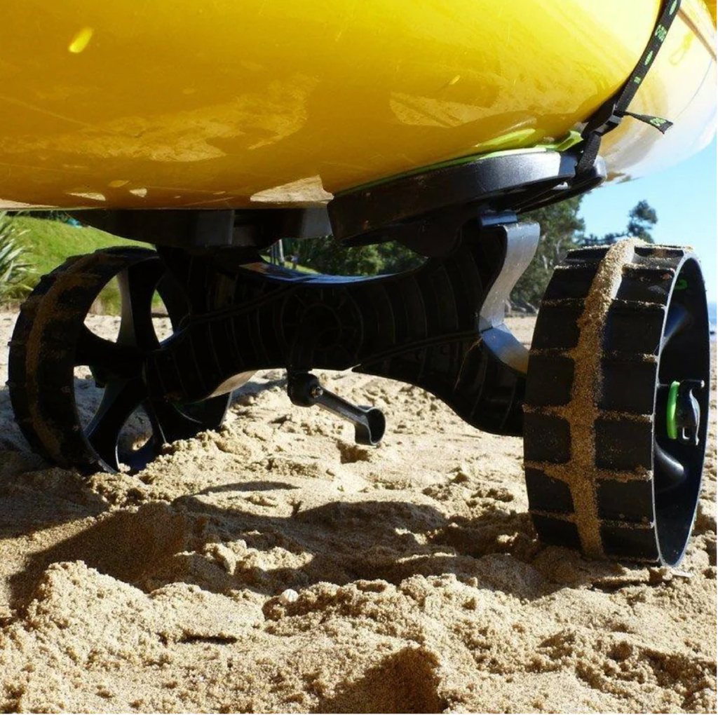 The C-Tug Kayak Trolley strapped to the bottom of a boat in the sand